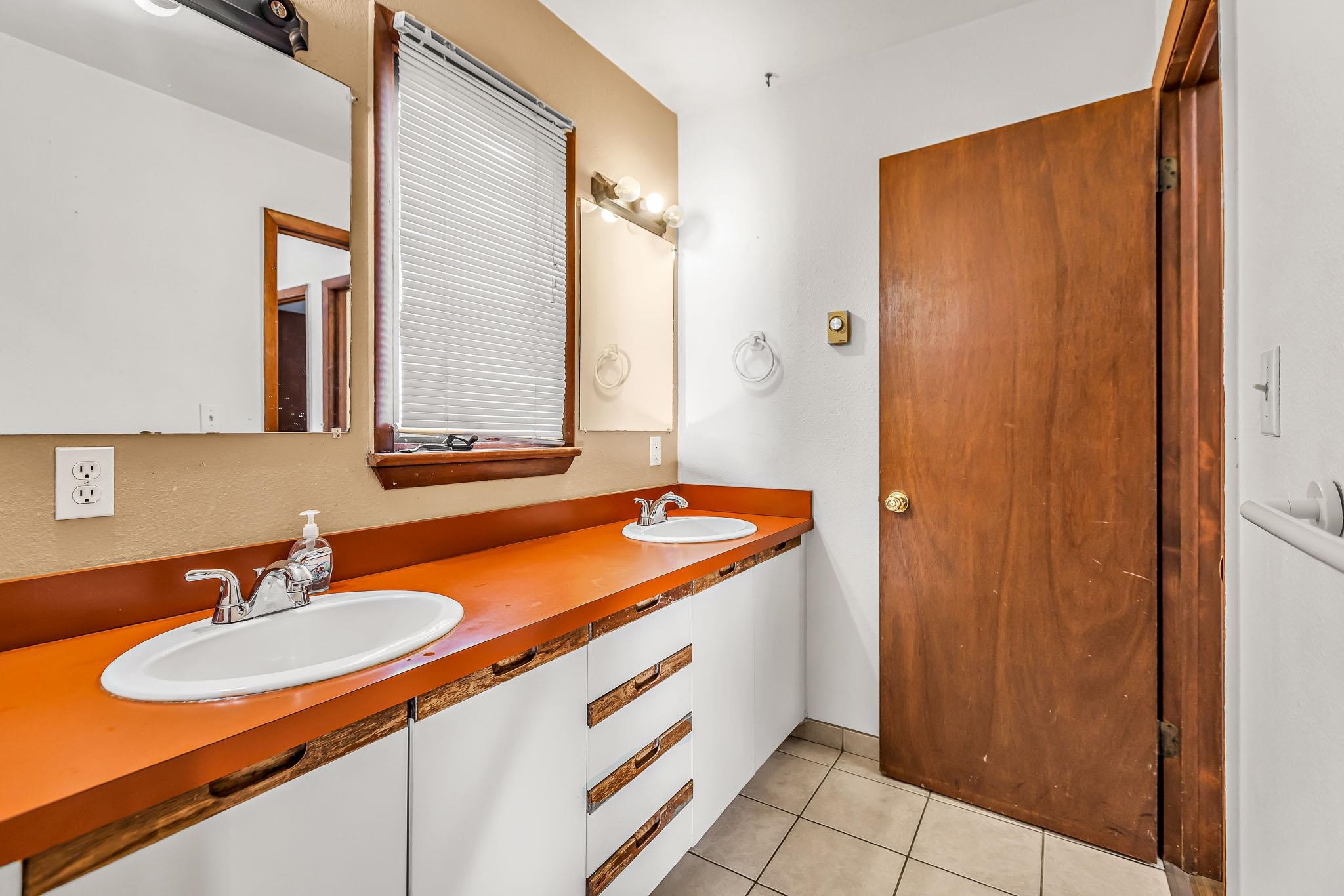 759 Elder Court Rifle, CO 81650 - Photo 13 of 26 a bathroom with a sink and a mirror
