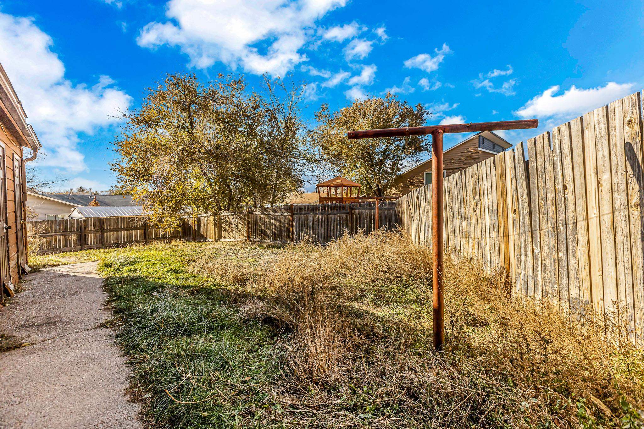 759 Elder Court Rifle, CO 81650 - Photo 16 of 26 a view of a yard with wooden fence