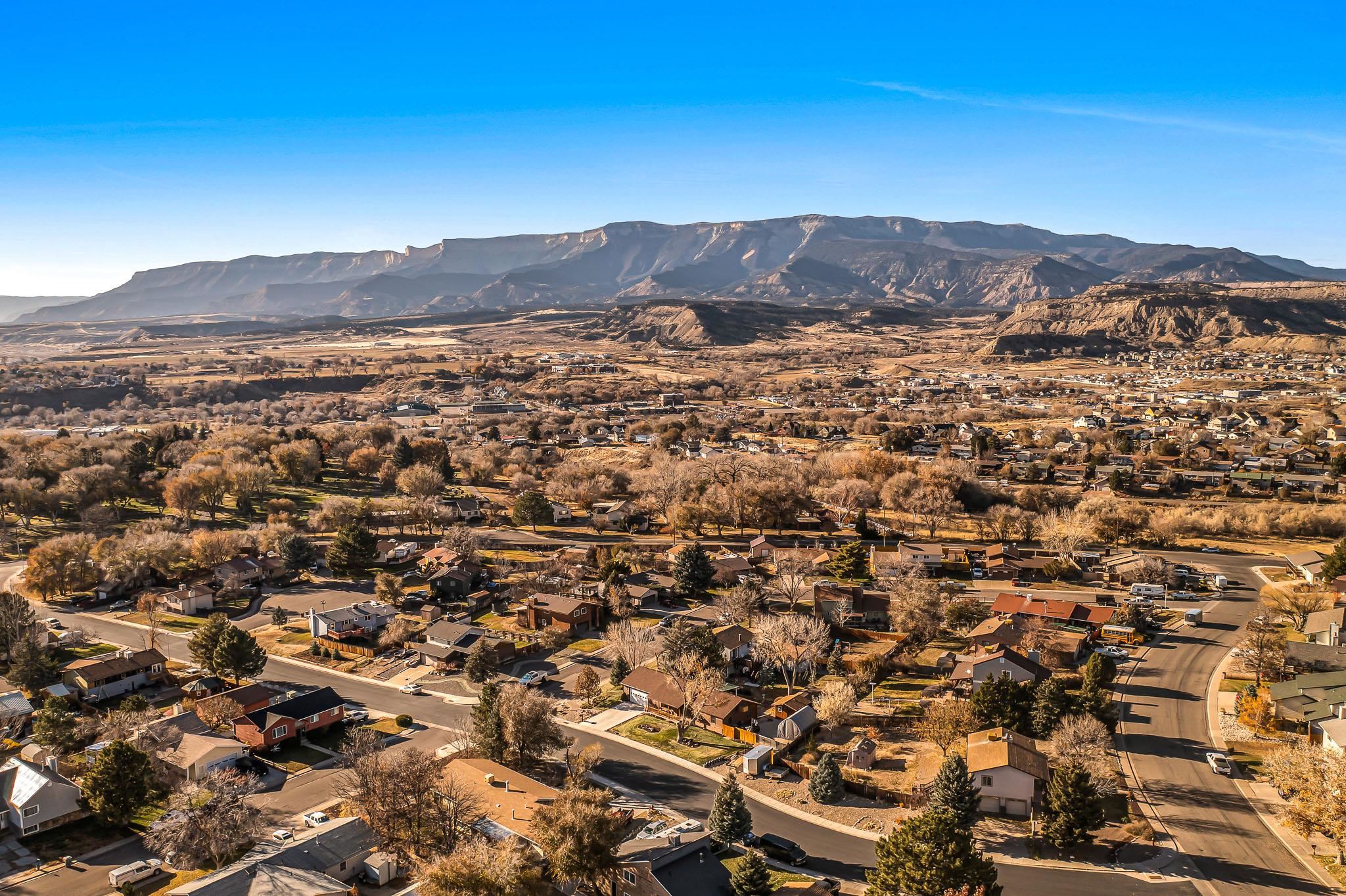 759 Elder Court Rifle, CO 81650 - Photo 17 of 26 an aerial view of residential house and green space