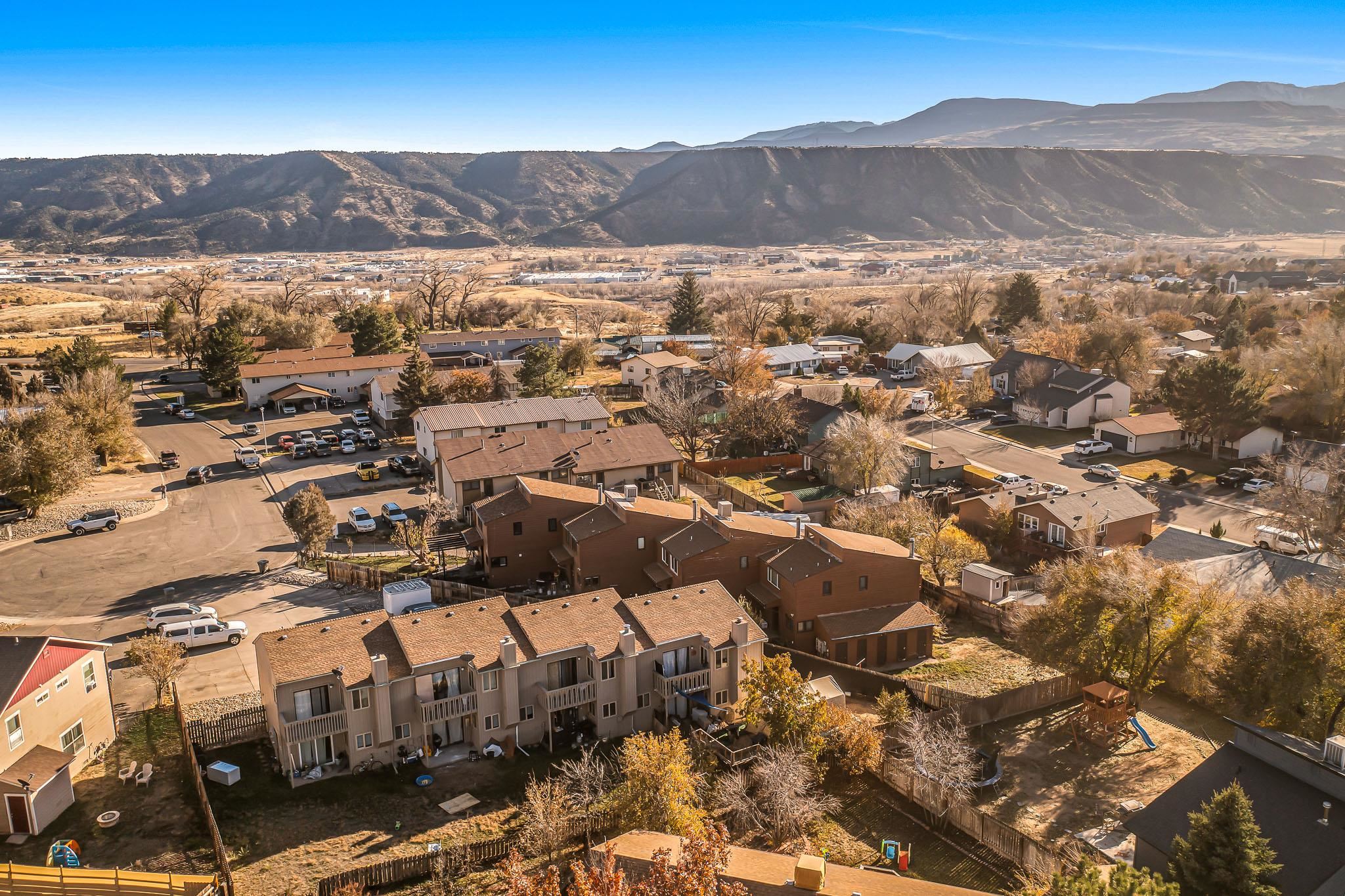 759 Elder Court Rifle, CO 81650 - Photo 23 of 26 an aerial view of residential houses with a city view