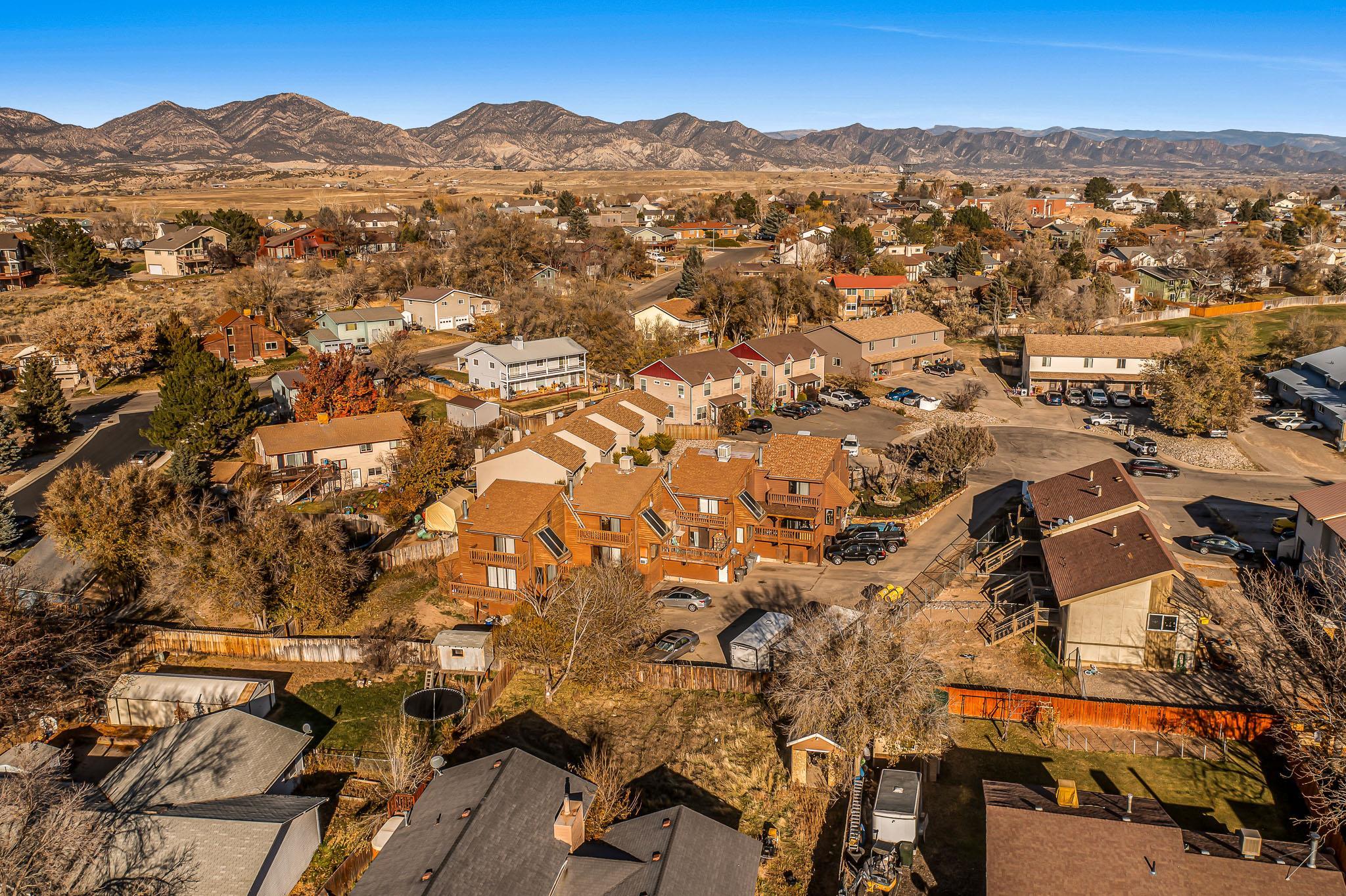 759 Elder Court Rifle, CO 81650 - Photo 24 of 26 an aerial view of residential houses with outdoor space and trees