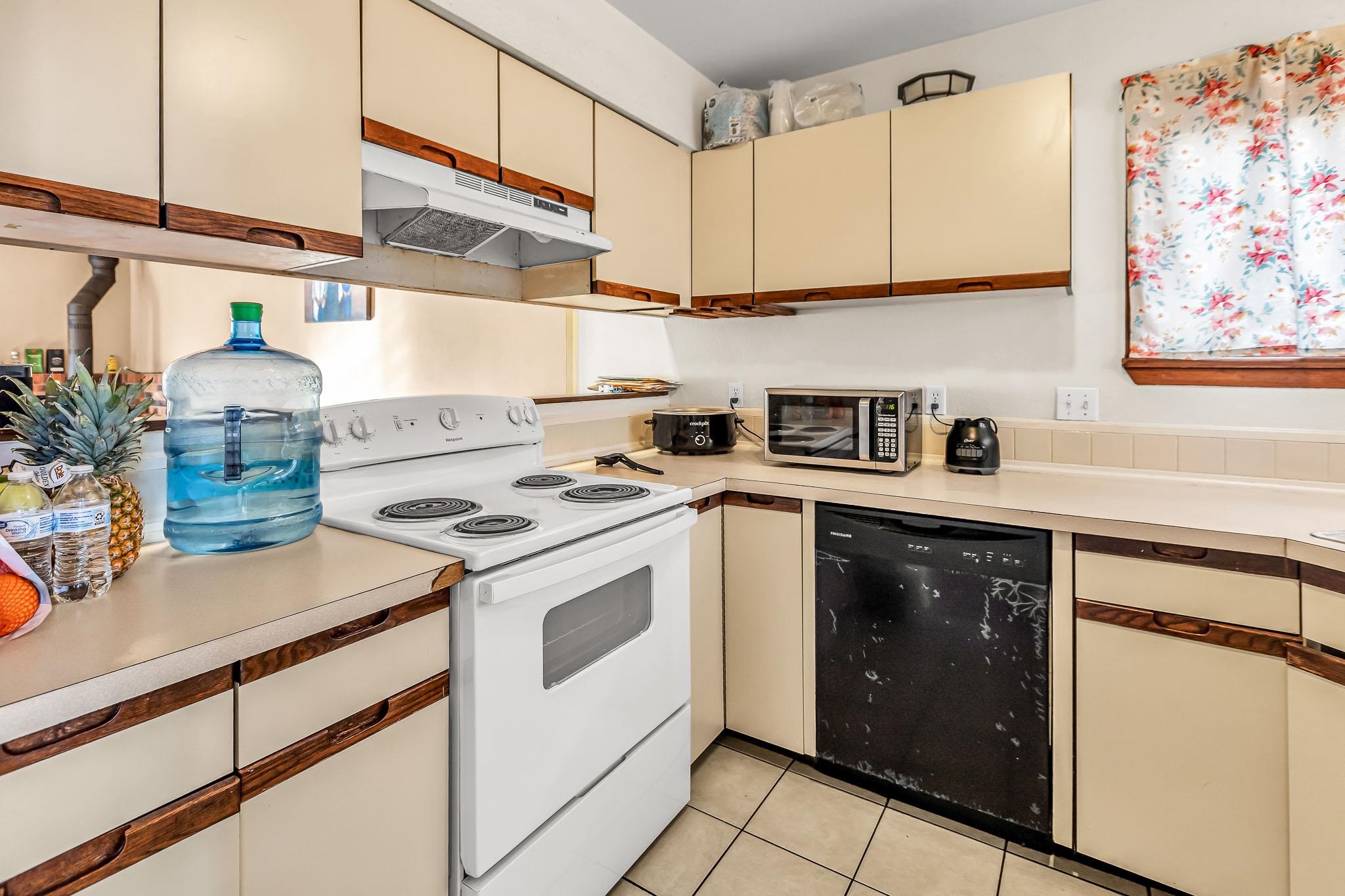 759 Elder Court Rifle, CO 81650 - Photo 6 of 26 a kitchen with stainless steel appliances granite countertop a stove and a sink