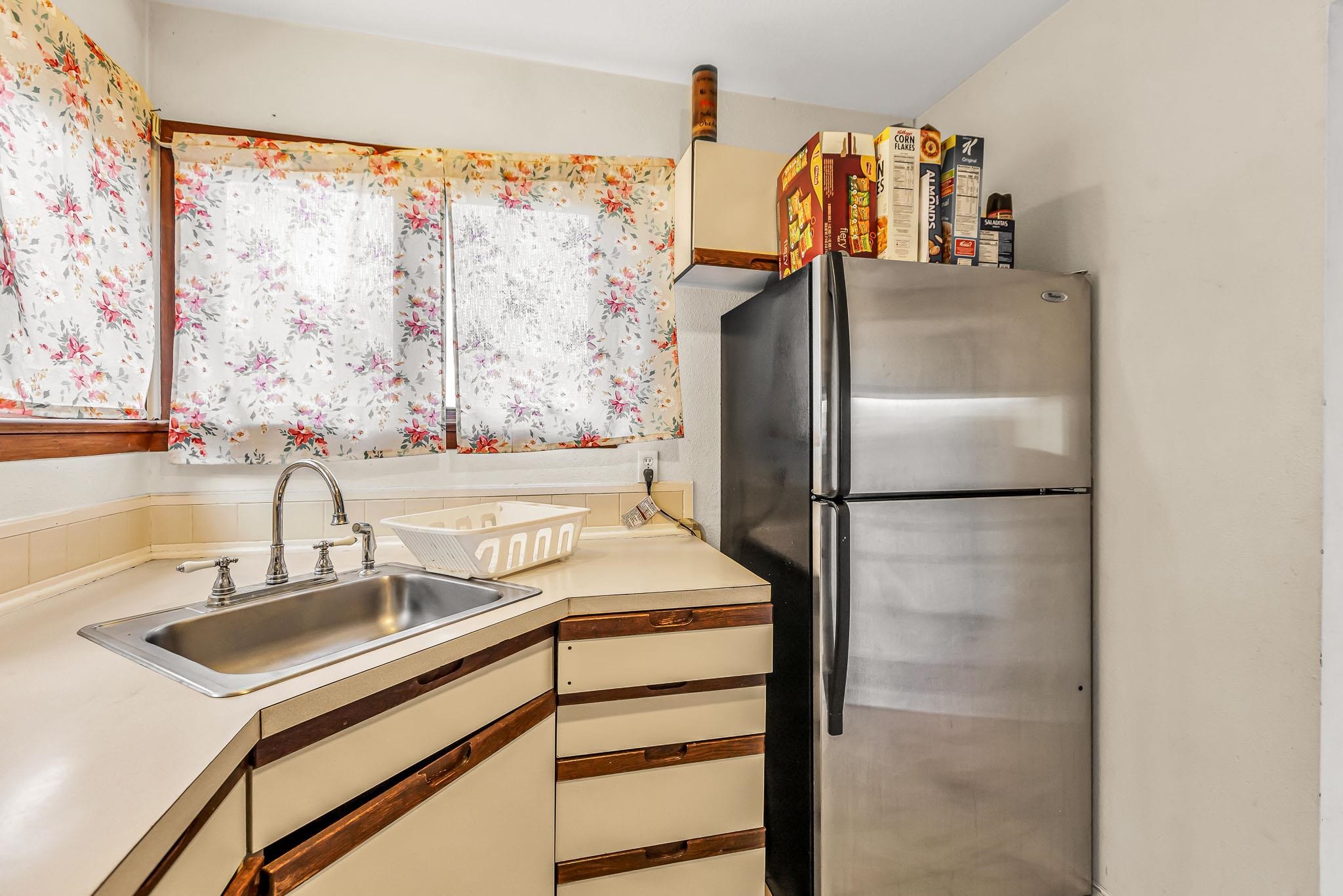 759 Elder Court Rifle, CO 81650 - Photo 7 of 26 a kitchen with a sink and a refrigerator