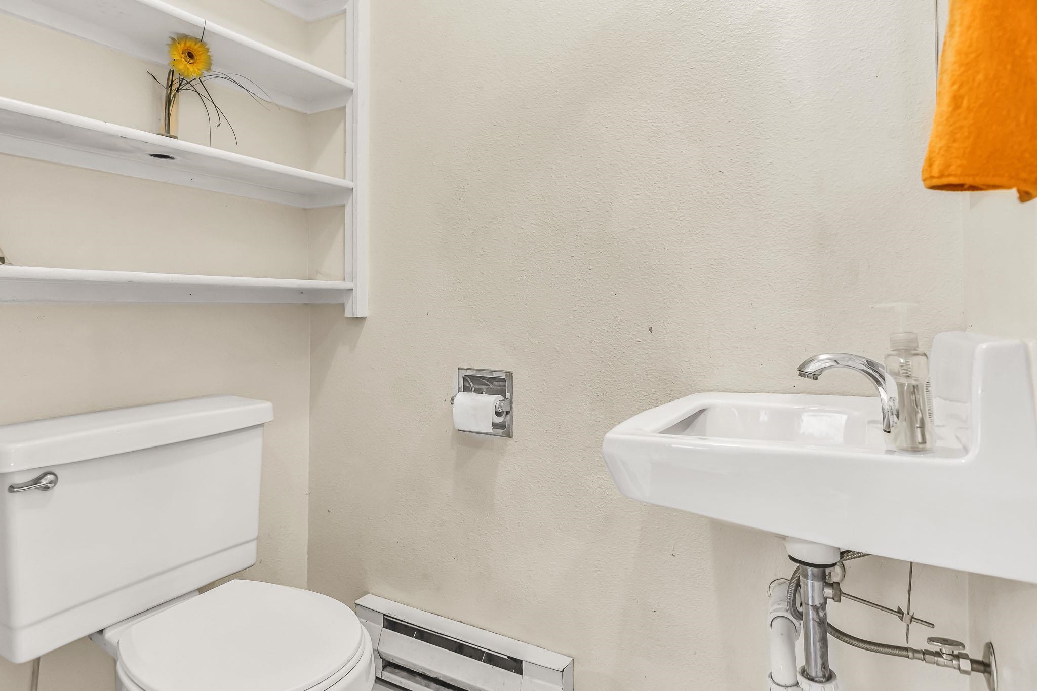 759 Elder Court Rifle, CO 81650 - Photo 8 of 26 a bathroom with a sink a toilet and mirror