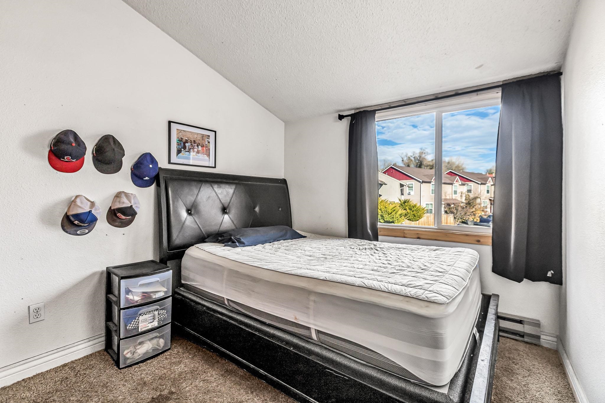 759 Elder Court Rifle, CO 81650 - Photo 10 of 26 a bedroom with a bed and a window