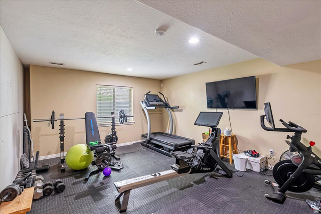 316 Azure Circle Draper, UT 84020 - Photo 31 of 48 Dedicated fitness space featuring rubberized flooring, recessed lighting, and a single window with blinds