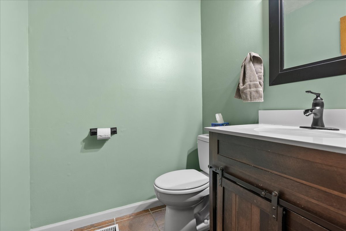1421 Godfrey Drive Normal, IL 61761 - Photo 15 of 28 a bathroom with a sink a toilet and mirror