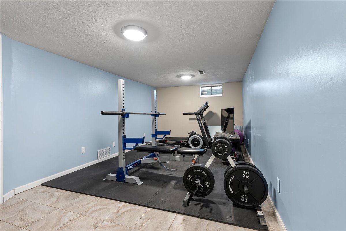1421 Godfrey Drive Normal, IL 61761 - Photo 16 of 28 a view of a room with gym equipment