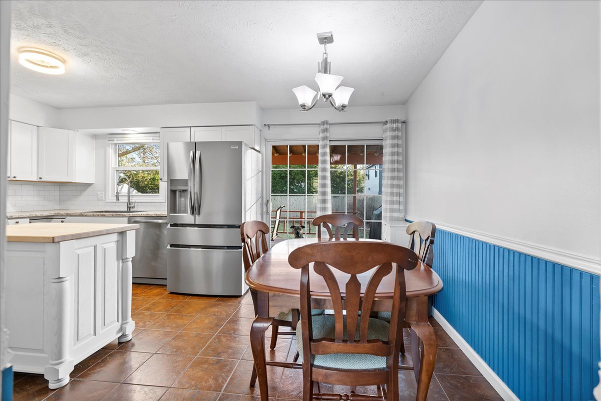 1421 Godfrey Drive Normal, IL 61761 - Photo 8 of 28 a view of a dining room with furniture and chandelier