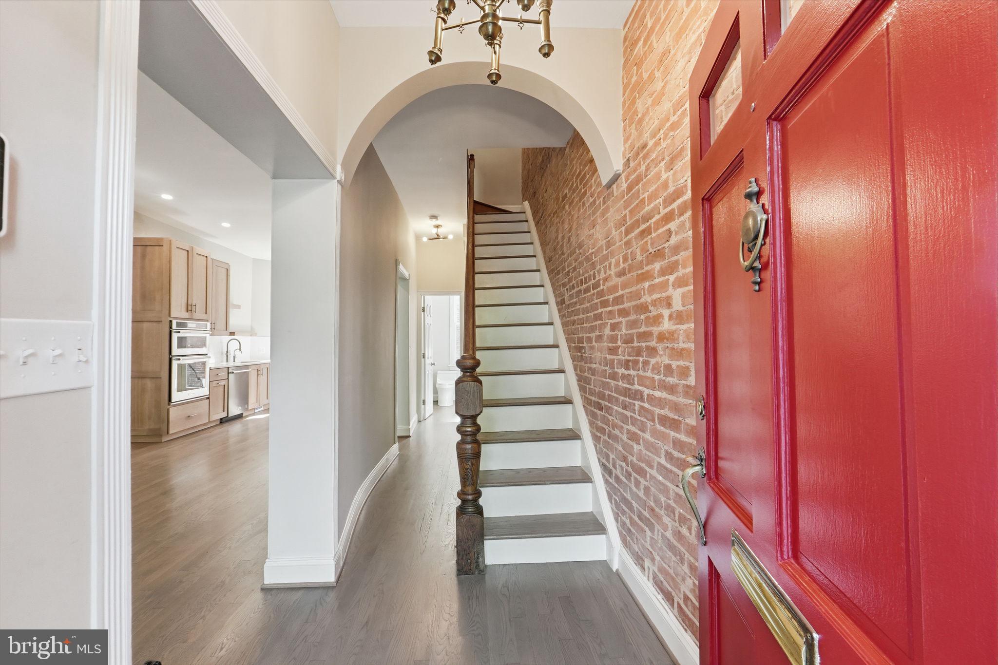 706 12th Street Northeast Washington, DC 20002 - Photo 4 of 49 a view of a hallway with entryway wooden floor and front door