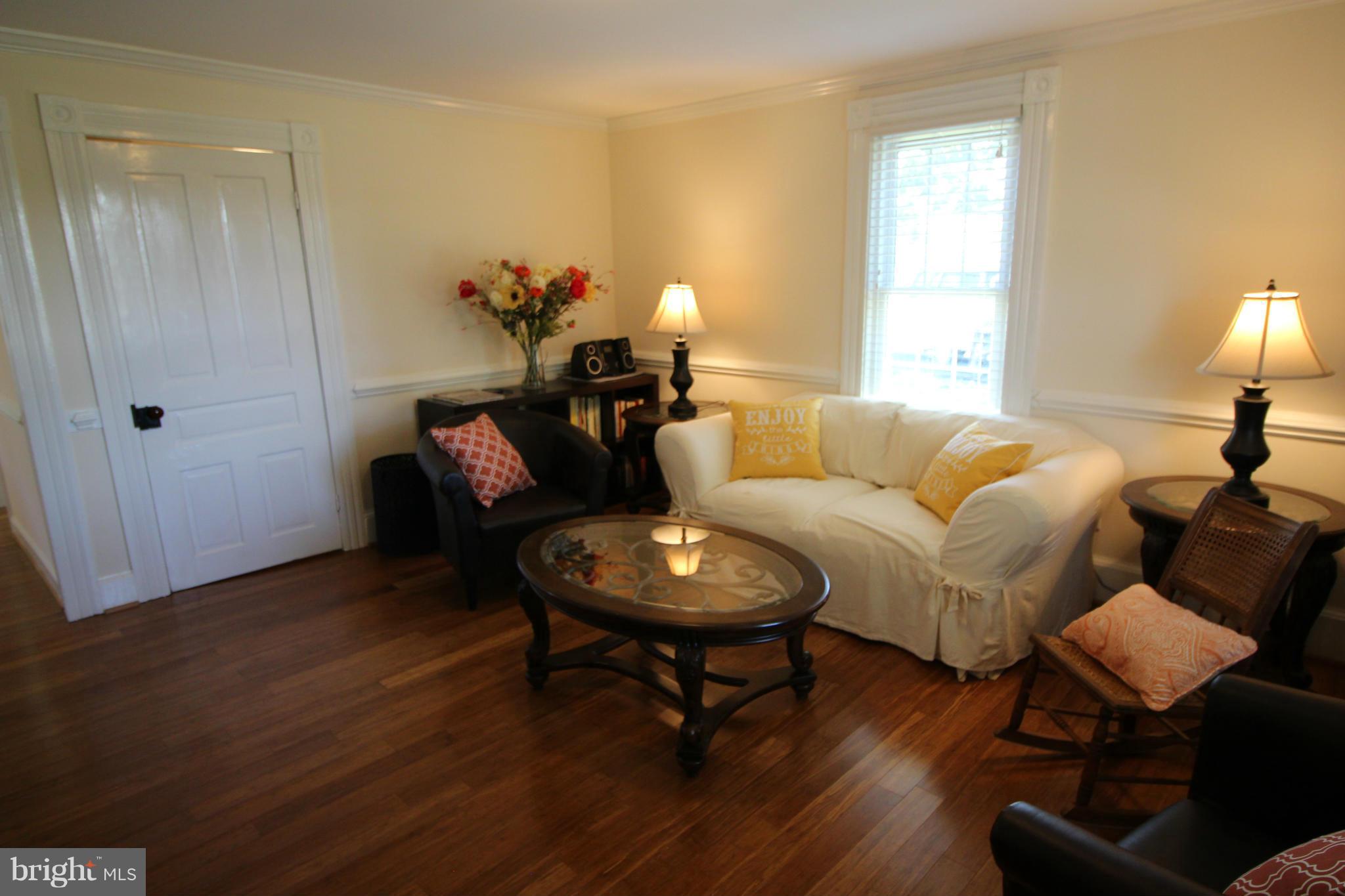 2280 Reliance Road Middletown, VA 22645 - Photo 14 of 28 a living room with furniture and a wooden floor
