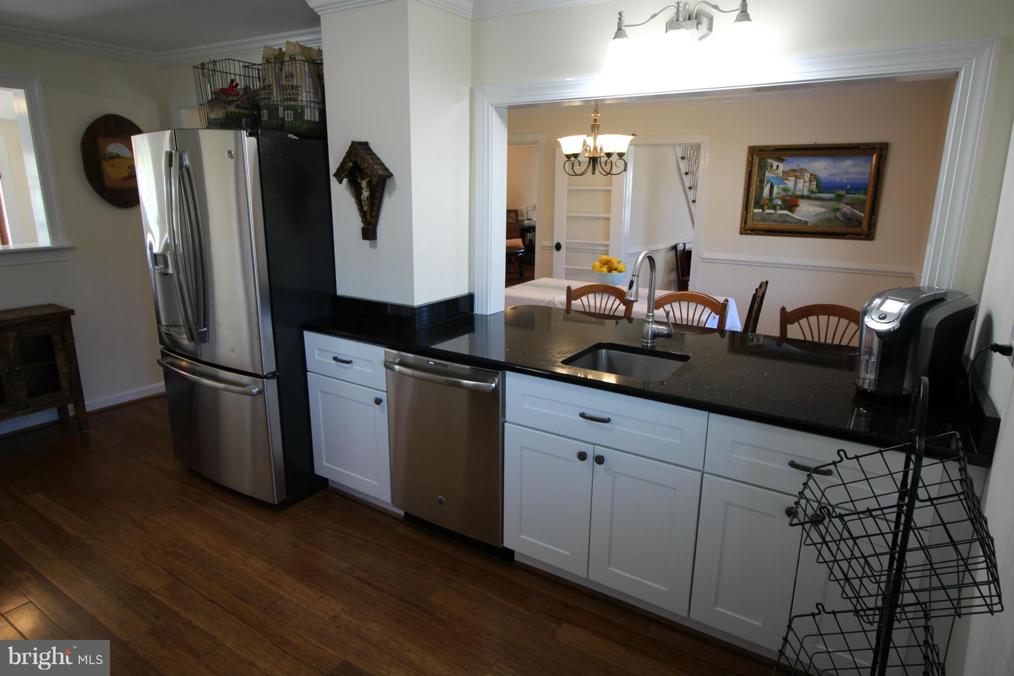 2280 Reliance Road Middletown, VA 22645 - Photo 10 of 28 a kitchen with stainless steel appliances a refrigerator a stove a sink and a refrigerator