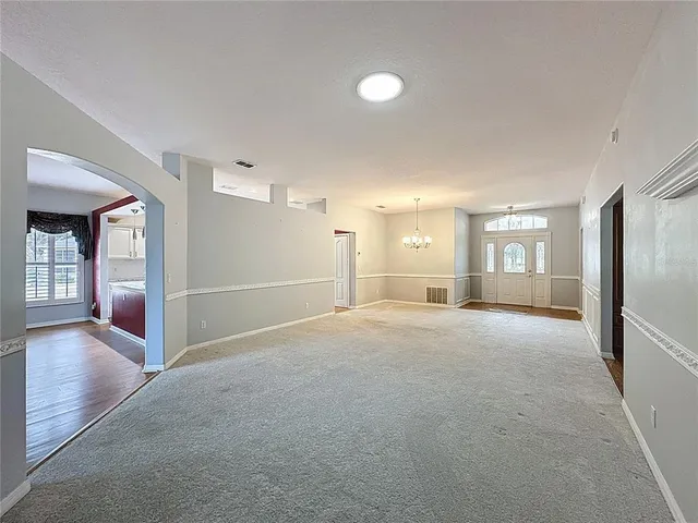 a kitchen with stainless steel appliances granite countertop a sink and dishwasher a stove top oven with wooden floor