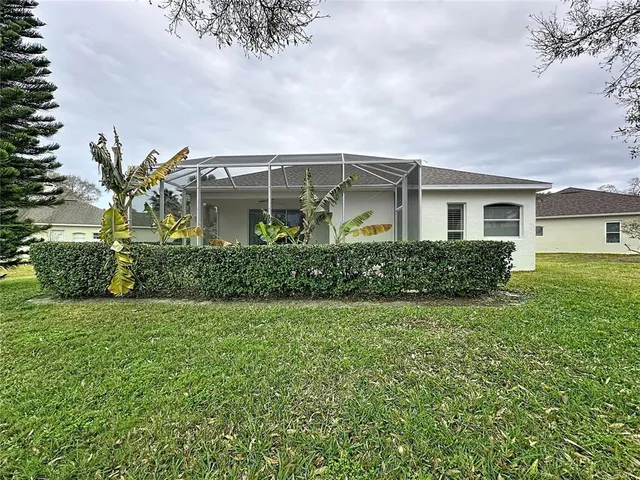 a view of a lake with a houses in the background