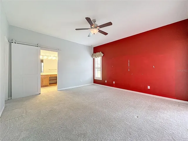 a yard with lots of green space and trees