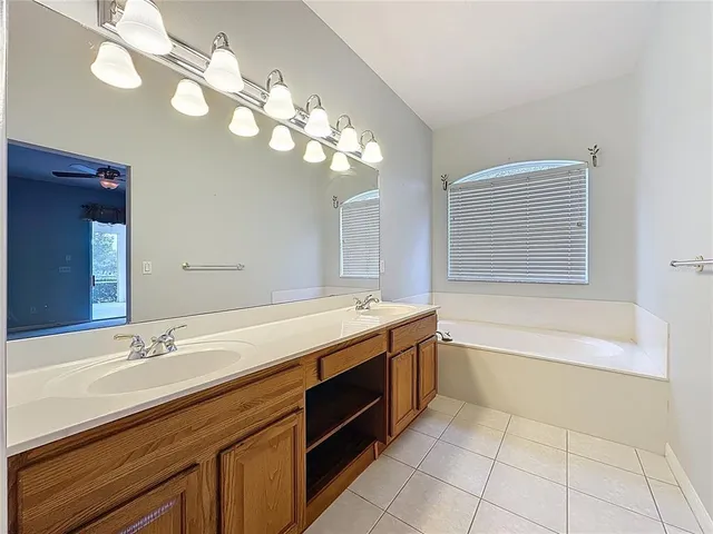 a living room with lots of furniture and a chandelier