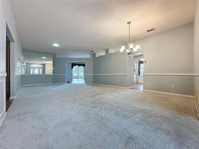 a kitchen with granite countertop a stove and cabinets