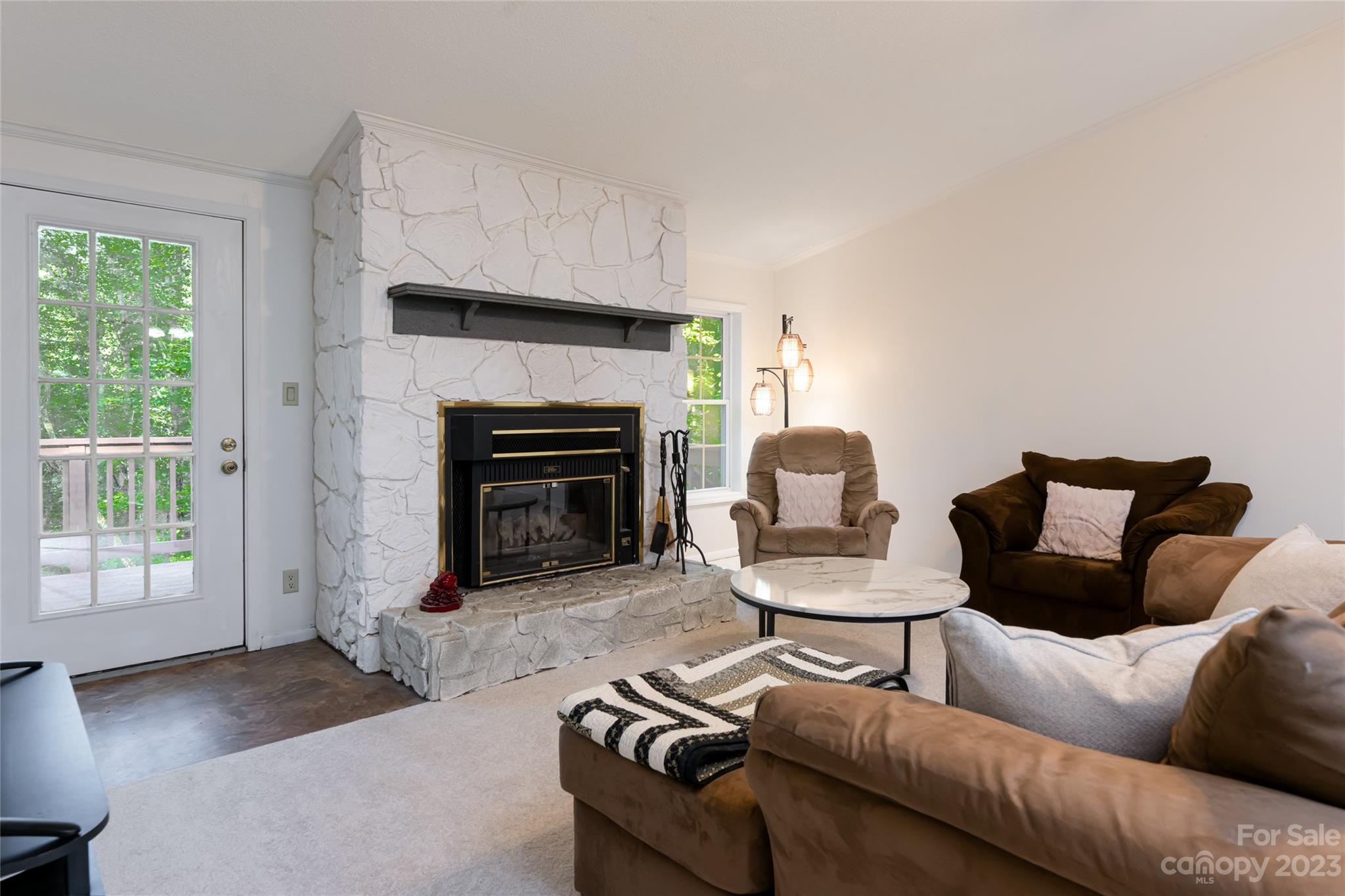 30 Clifford Drive Fairview, NC 28730 - Photo 13 of 47 a living room with furniture and a fireplace