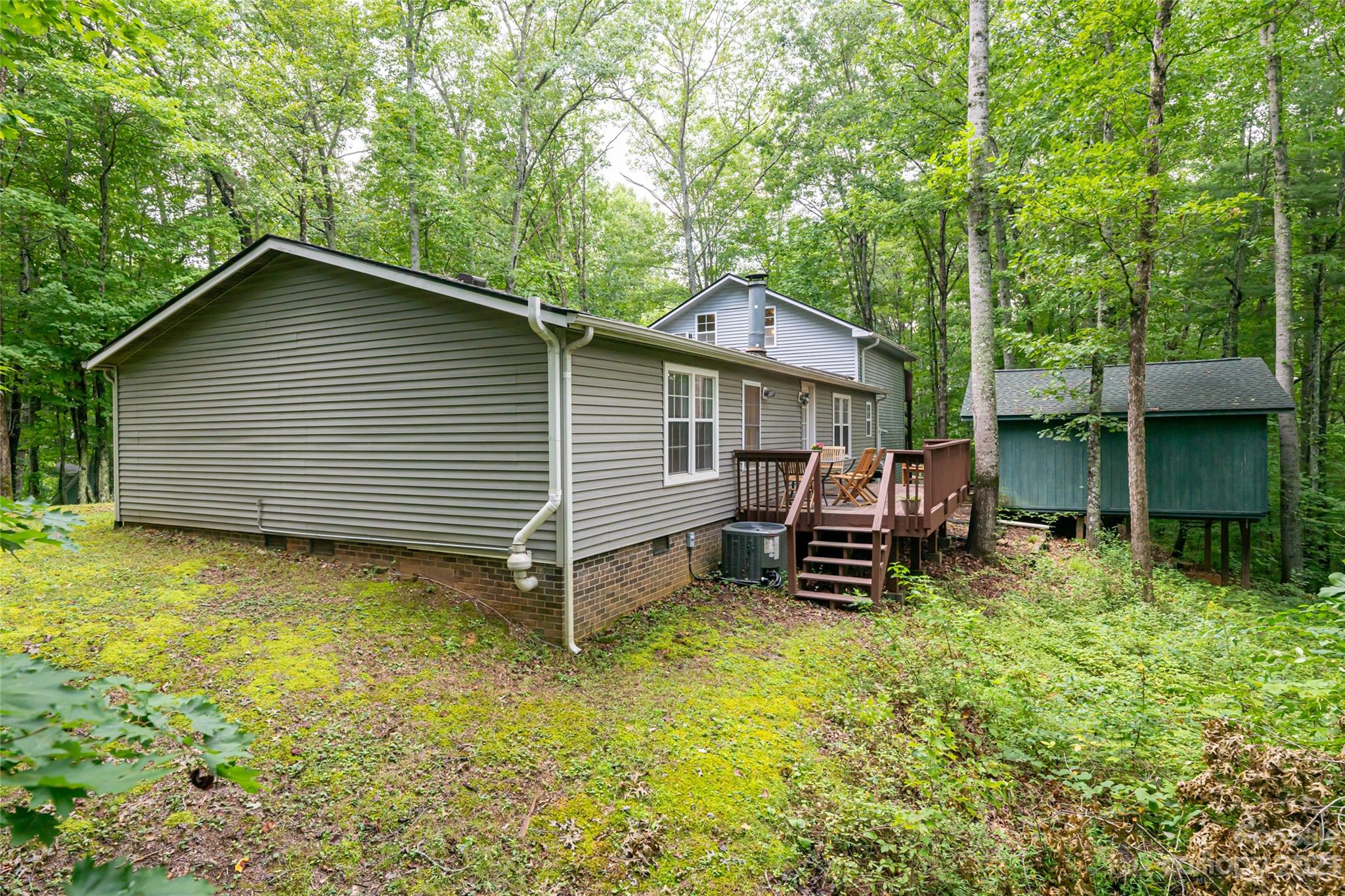 30 Clifford Drive Fairview, NC 28730 - Photo 44 of 47 a backyard of a house with barbeque oven and trees
