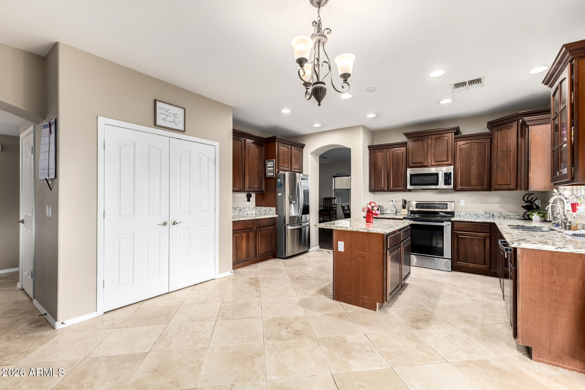 24541 Plum Road Florence, AZ 85132 - Photo 13 of 47 a kitchen with a refrigerator and a sink