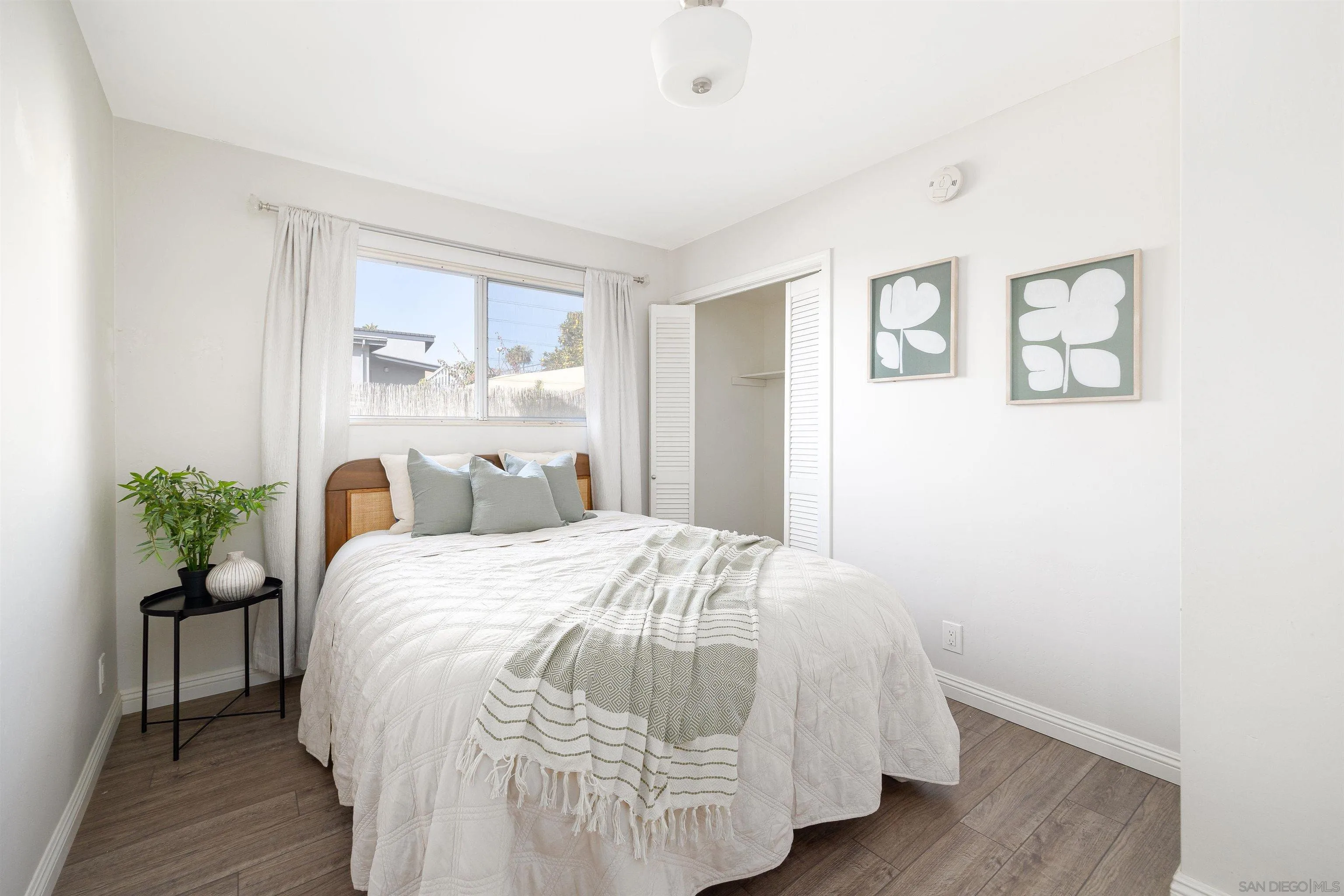 444 Chesterfield Drive Cardiff, CA 92007 - Photo 14 of 29 a bedroom with a bed and a table