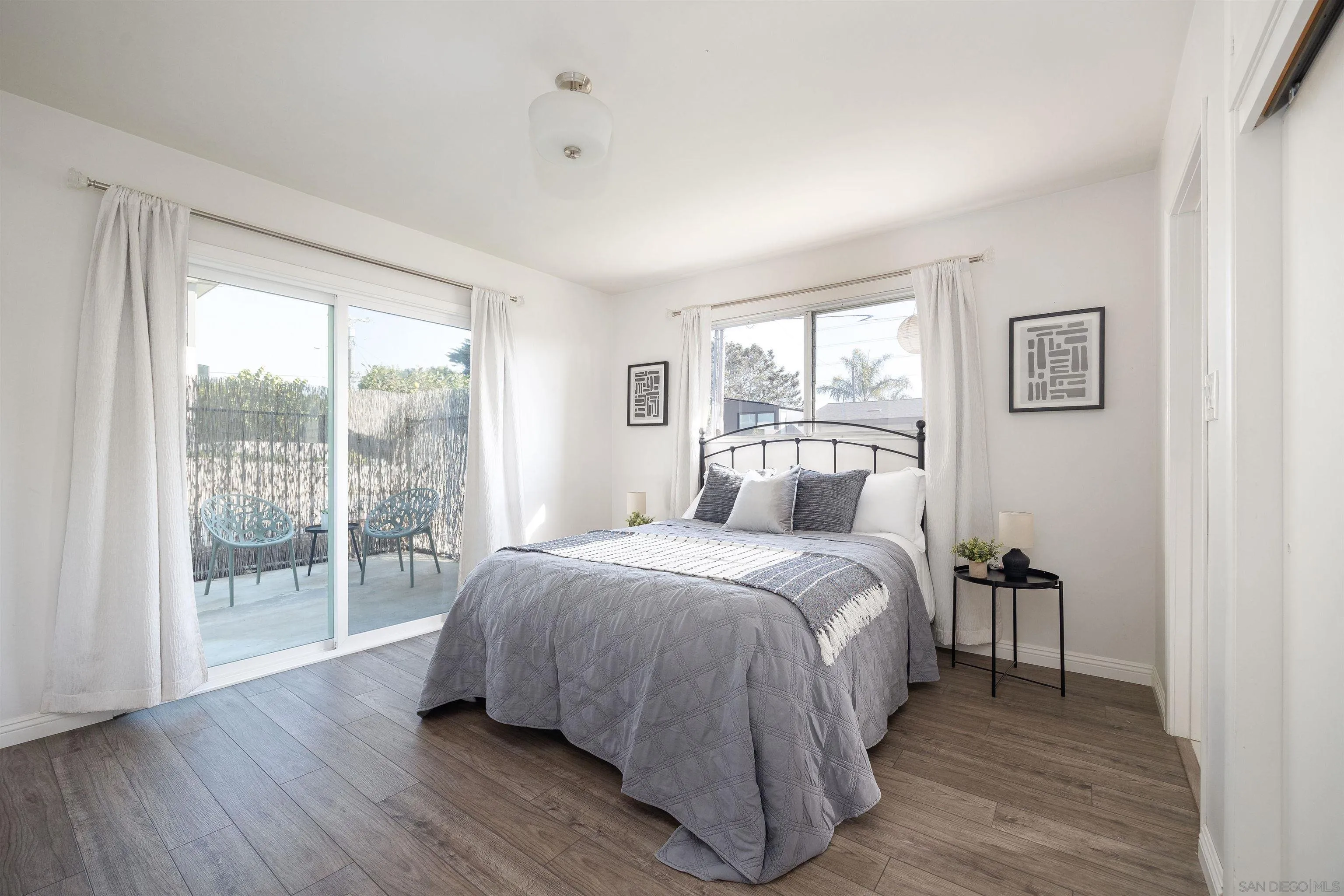 444 Chesterfield Drive Cardiff, CA 92007 - Photo 17 of 29 a bedroom with a large bed and a window