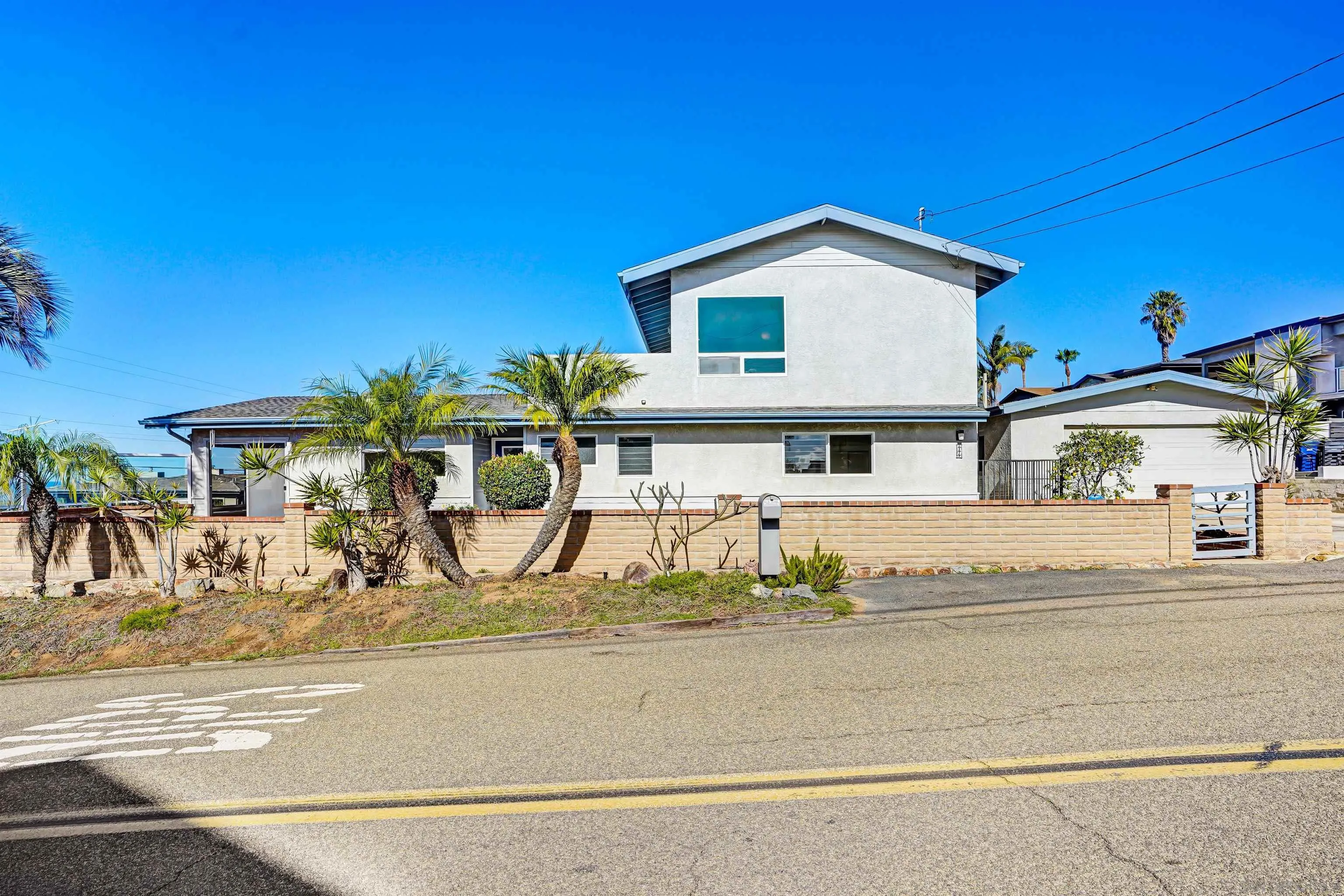 444 Chesterfield Drive Cardiff, CA 92007 - Photo 3 of 29 a view of a house with a swimming pool