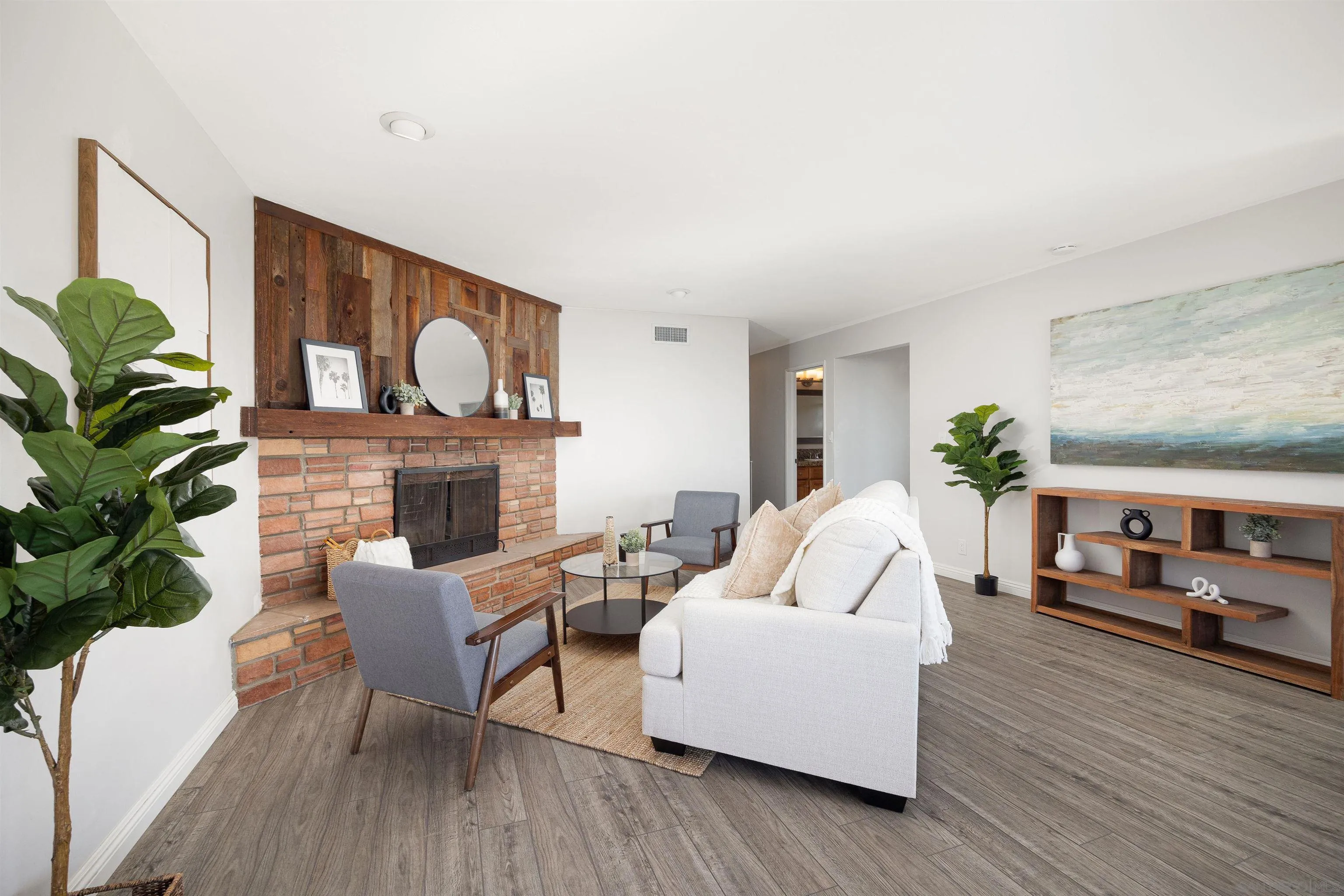 444 Chesterfield Drive Cardiff, CA 92007 - Photo 6 of 29 a living room with furniture and a fireplace