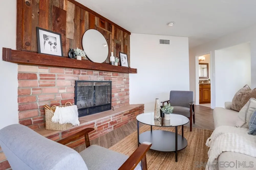 444 Chesterfield Drive Cardiff, CA 92007 - Photo 8 of 29 a living room with furniture and a fireplace
