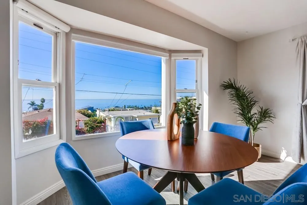 444 Chesterfield Drive Cardiff, CA 92007 - Photo 9 of 29 a view of a dining room with furniture window and wooden floor