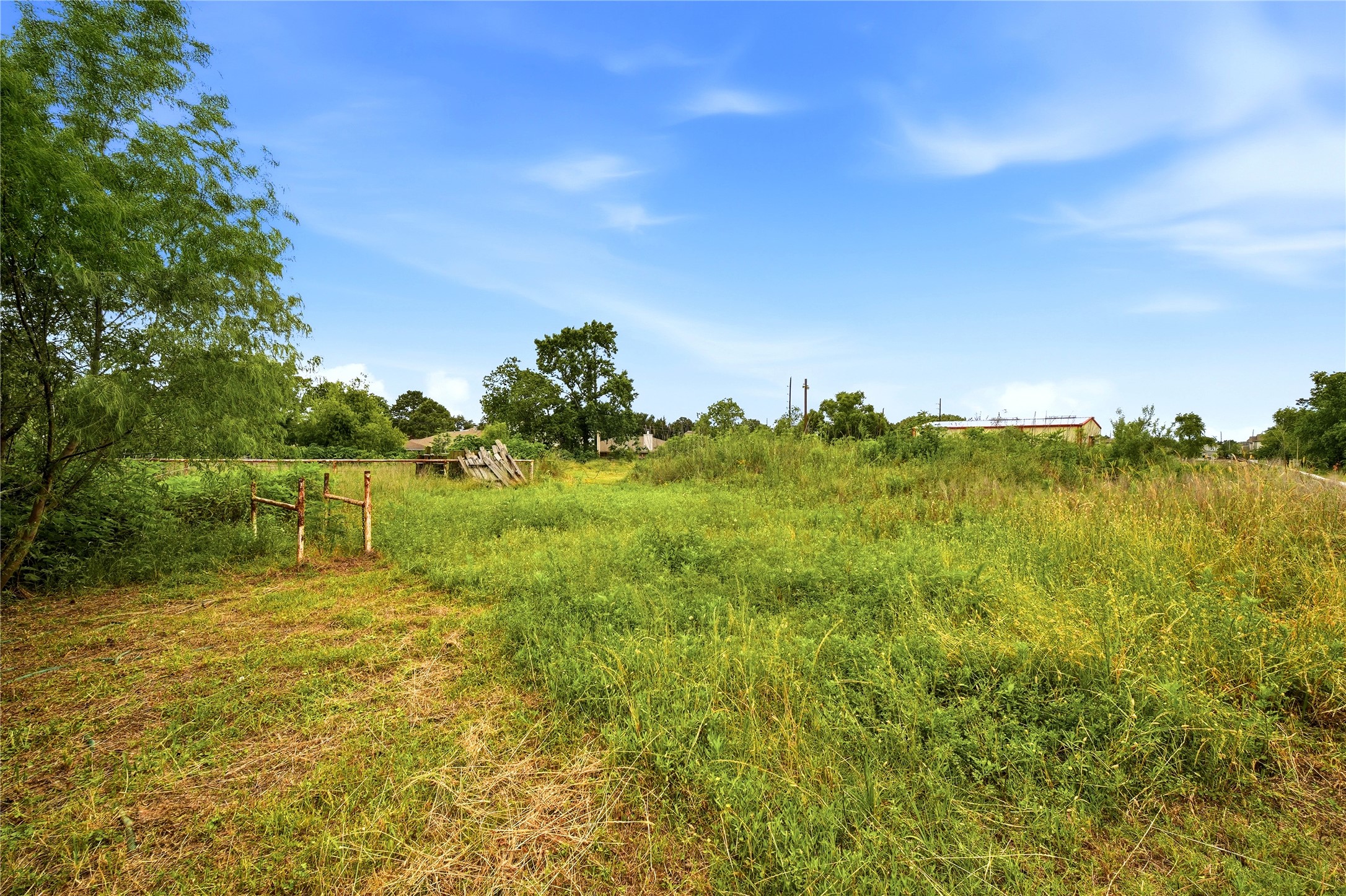 11741 Ezekiel Road Tomball, TX 77375 - Photo 25 of 30 a view of a lake with a yard