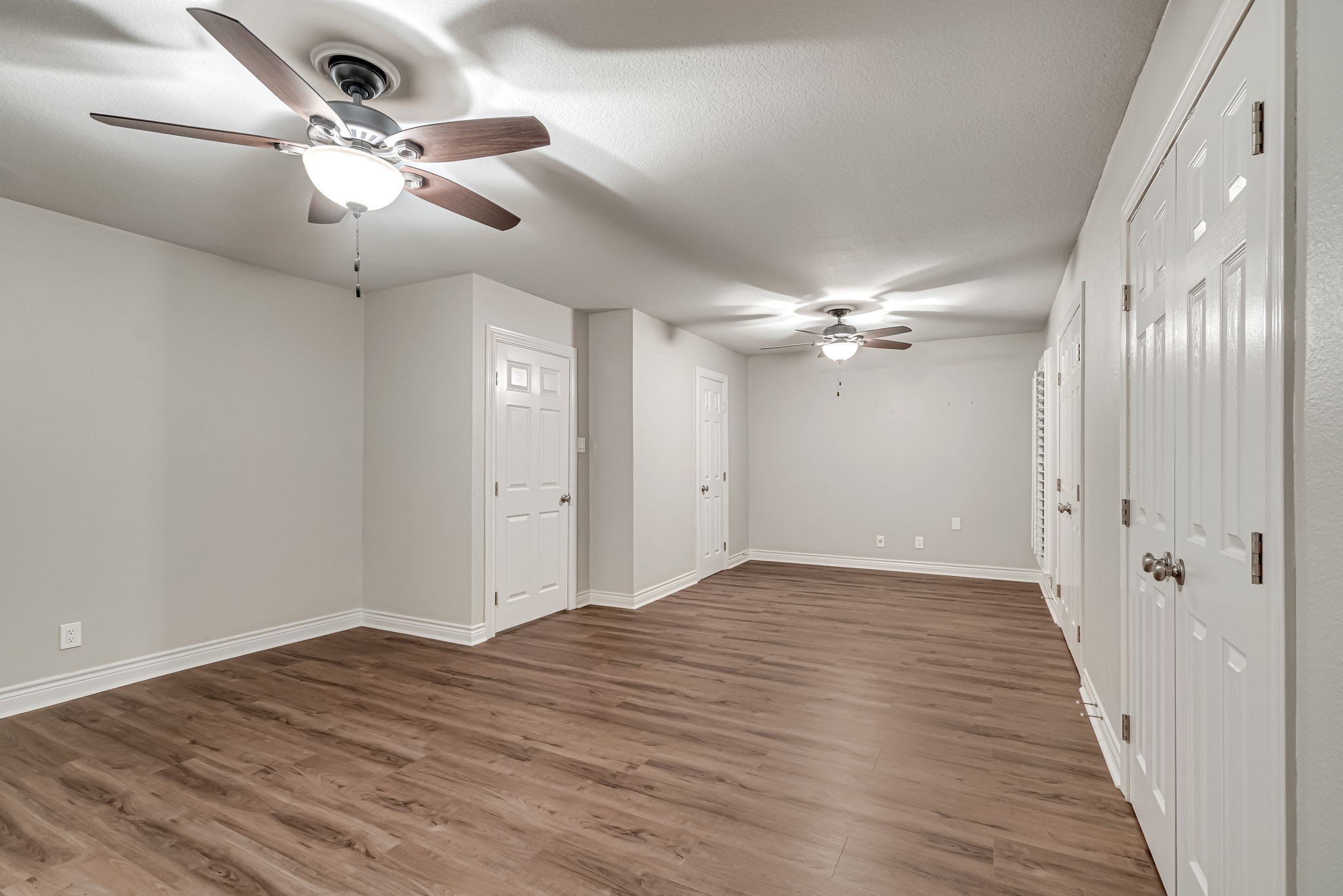 4702 Spring Lane Baytown, TX 77521 - Photo 18 of 34 wooden floor in an empty room