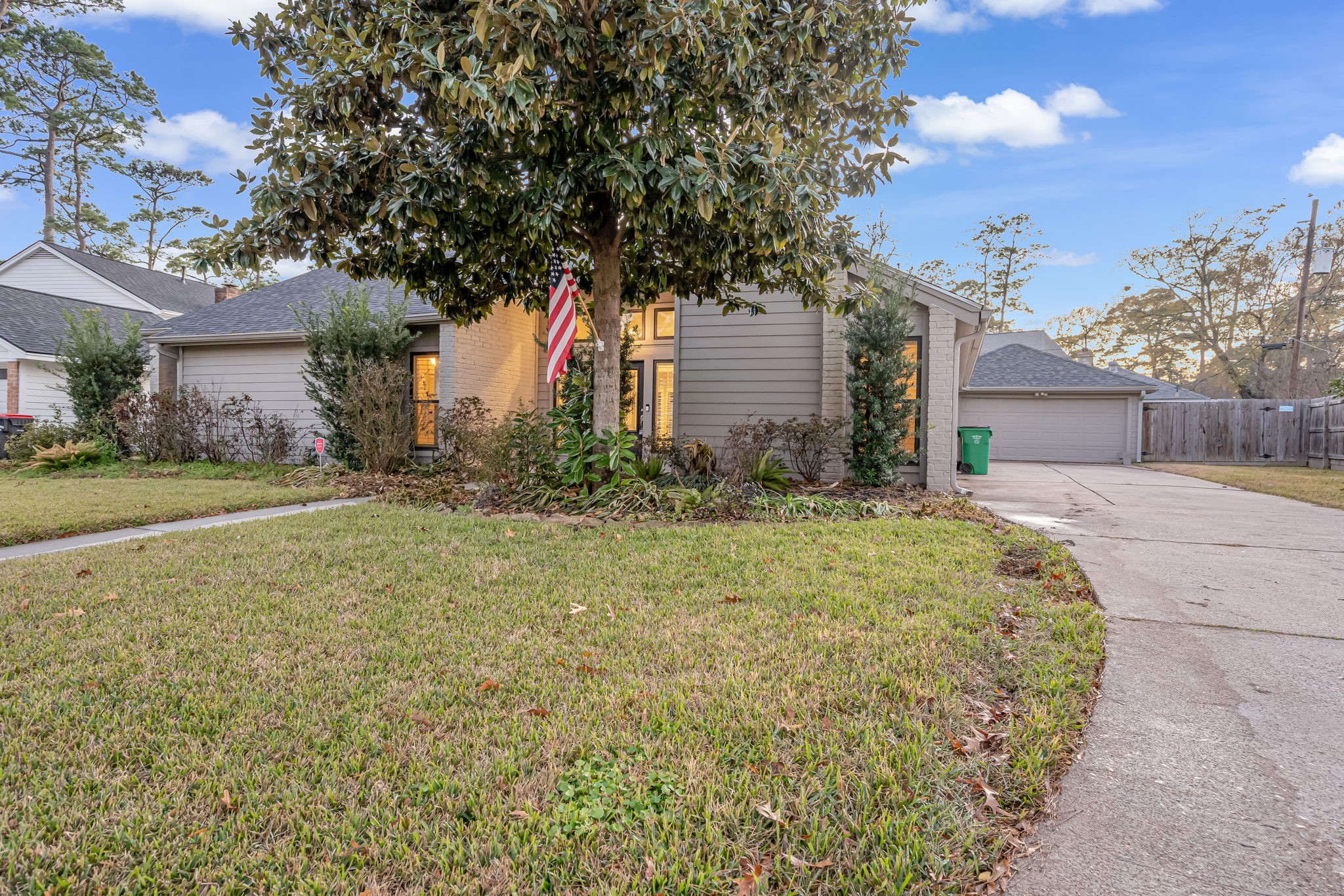 4702 Spring Lane Baytown, TX 77521 - Photo 2 of 34 a front view of a house with a yard and trees