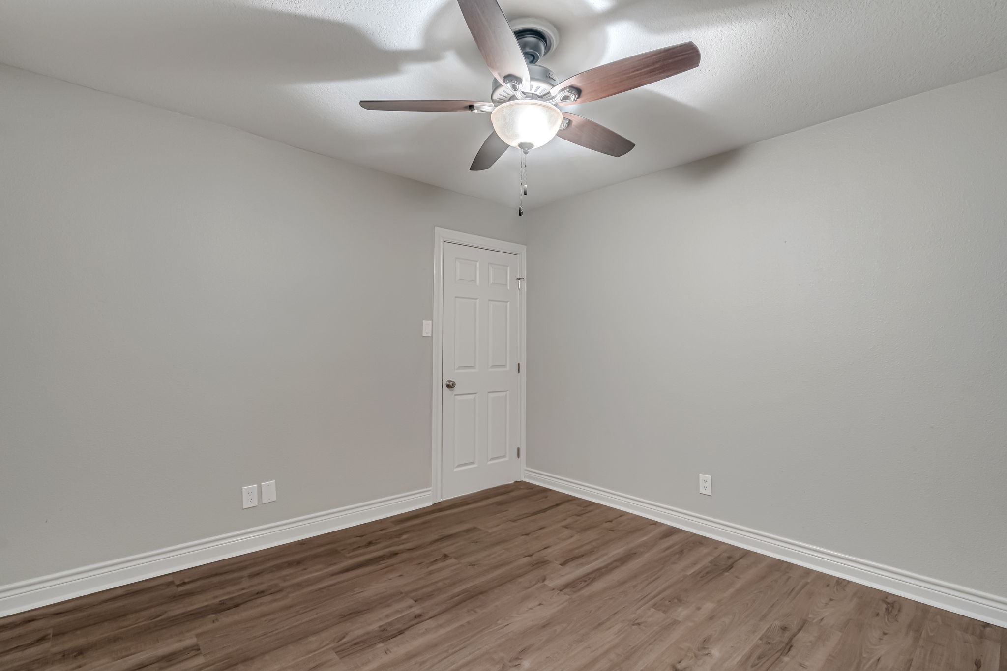 4702 Spring Lane Baytown, TX 77521 - Photo 23 of 34 a view of an empty room with wooden floor