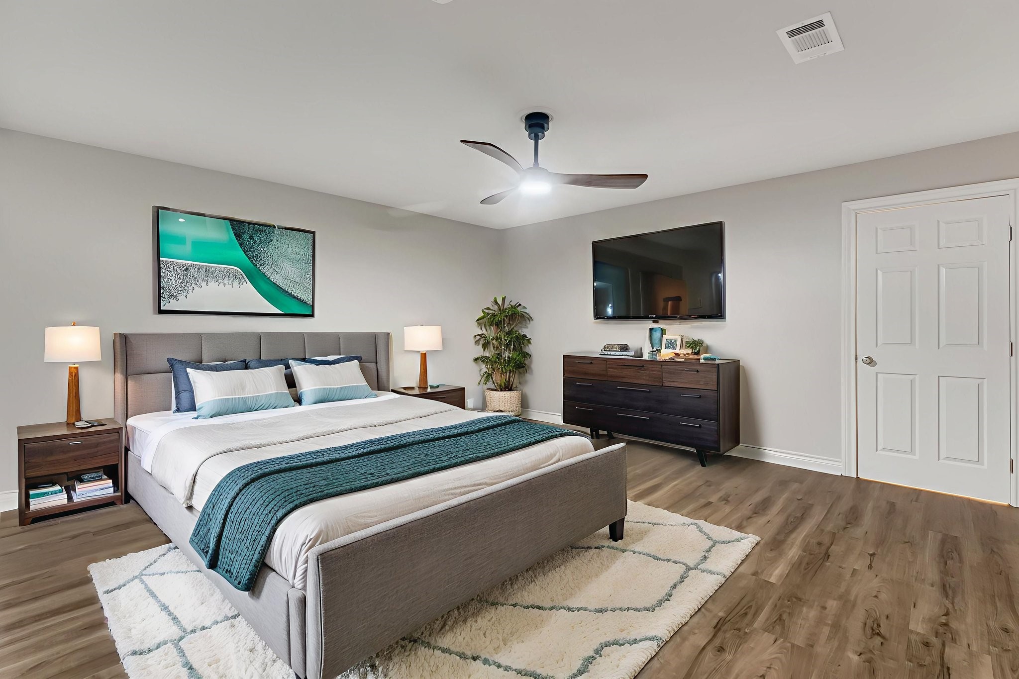 4702 Spring Lane Baytown, TX 77521 - Photo 25 of 34 a bedroom with a bed and a flat screen tv