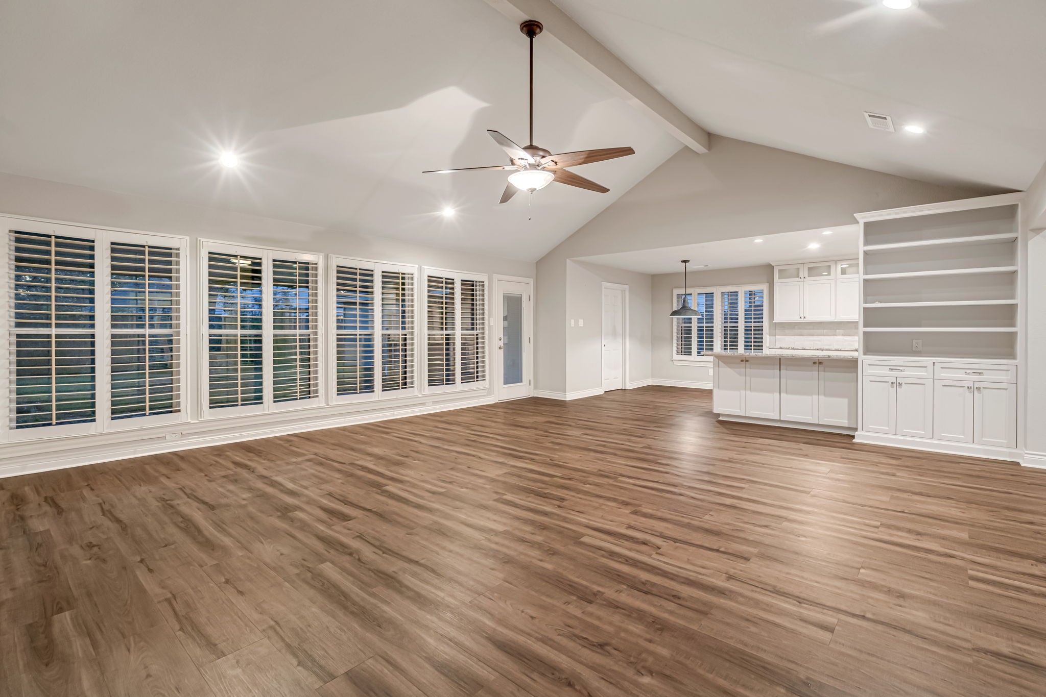 4702 Spring Lane Baytown, TX 77521 - Photo 8 of 34 a view of an empty room with wooden floor and a window