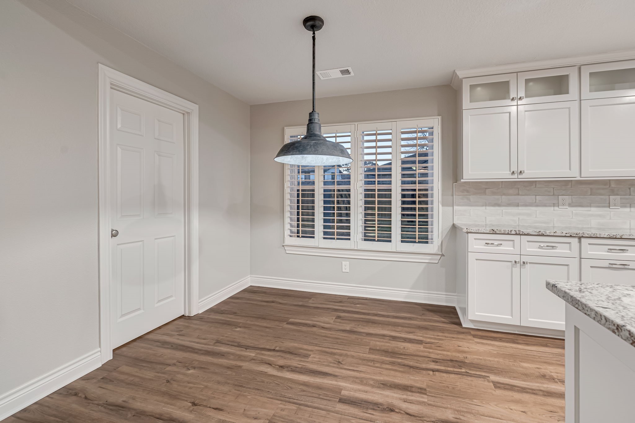 4702 Spring Lane Baytown, TX 77521 - Photo 9 of 34 a view of an empty room with a window and kitchen view