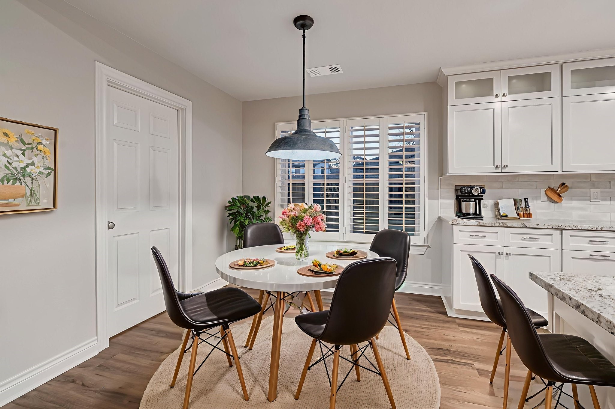 4702 Spring Lane Baytown, TX 77521 - Photo 10 of 34 a view of a dining room with furniture window and wooden floor