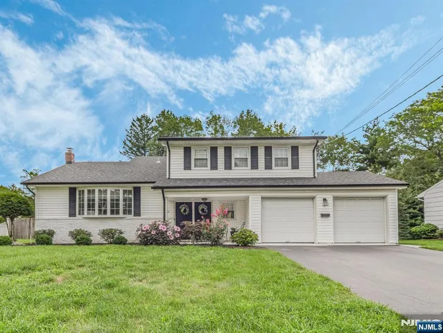 front view of a house with a garden