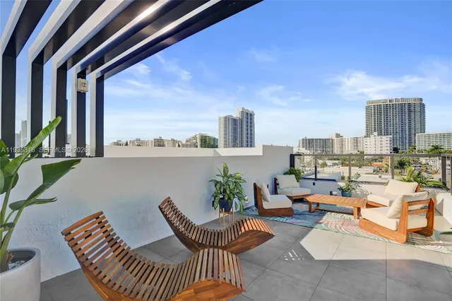 a view of a terrace with furniture