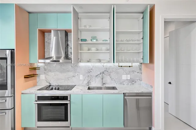 a kitchen with granite countertop a stove and a sink