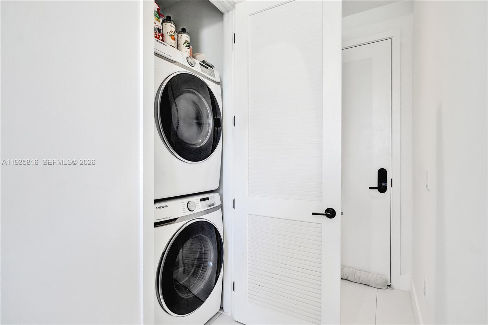 1030 15th Street, Unit PH5 Miami Beach, FL 33139 - Photo 19 of 38 a utility room with dryer and washer