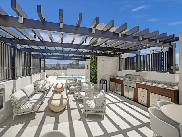 a view of a chairs and table in the patio