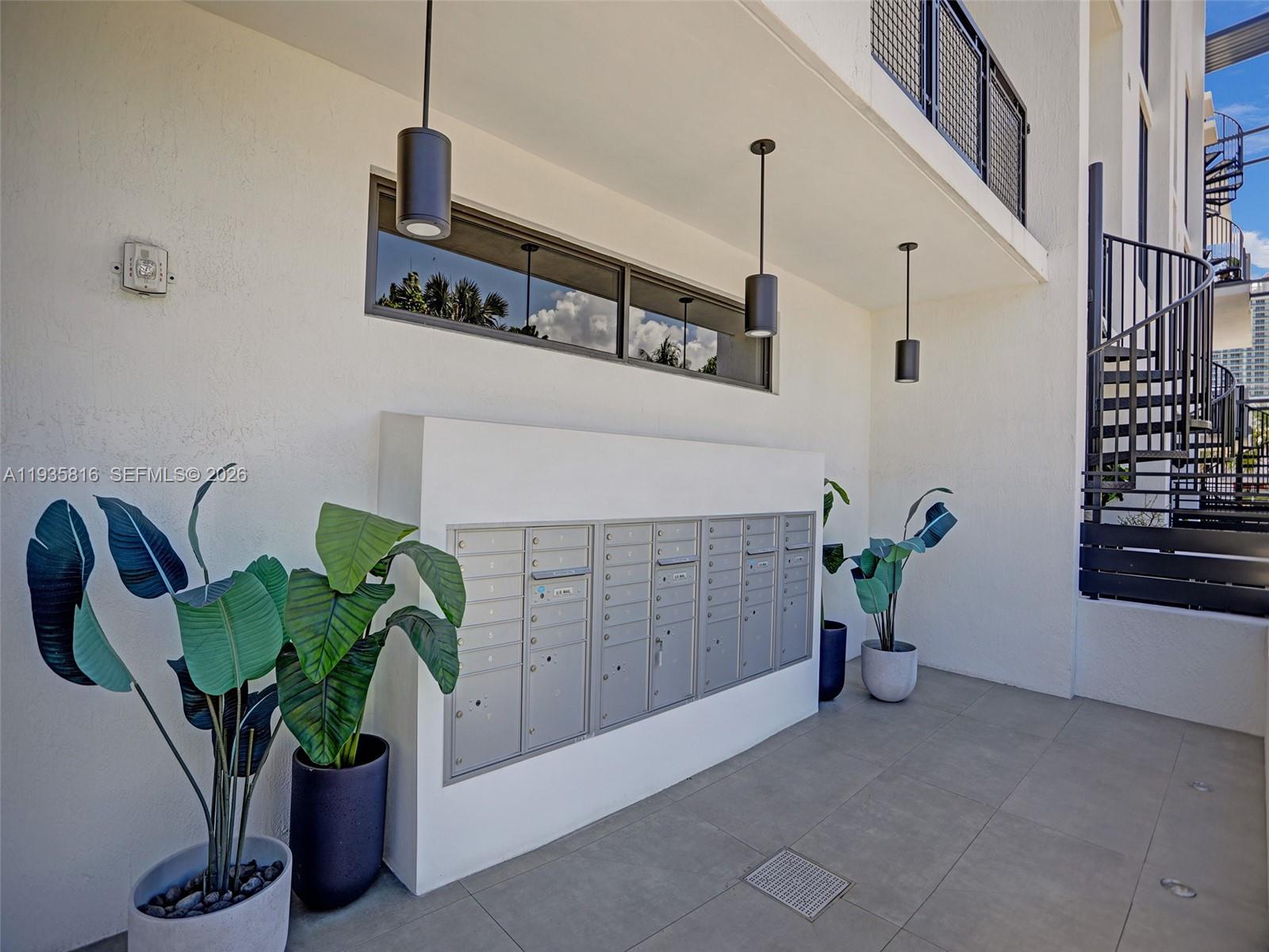1030 15th Street, Unit PH5 Miami Beach, FL 33139 - Photo 30 of 38 a potted plant sitting on top of a wall
