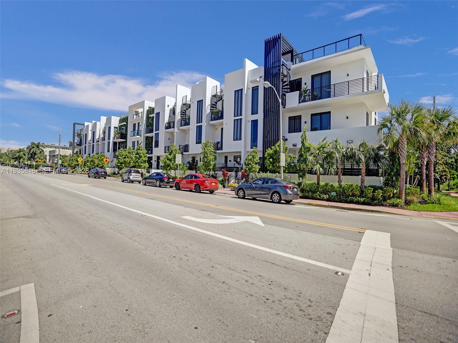 1030 15th Street, Unit PH5 Miami Beach, FL 33139 - Photo 37 of 38 a city street lined with buildings and trees