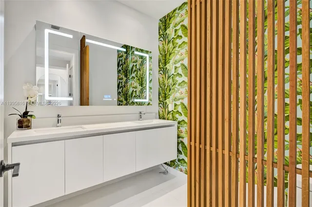 a spacious bathroom with a bathtub and a sink