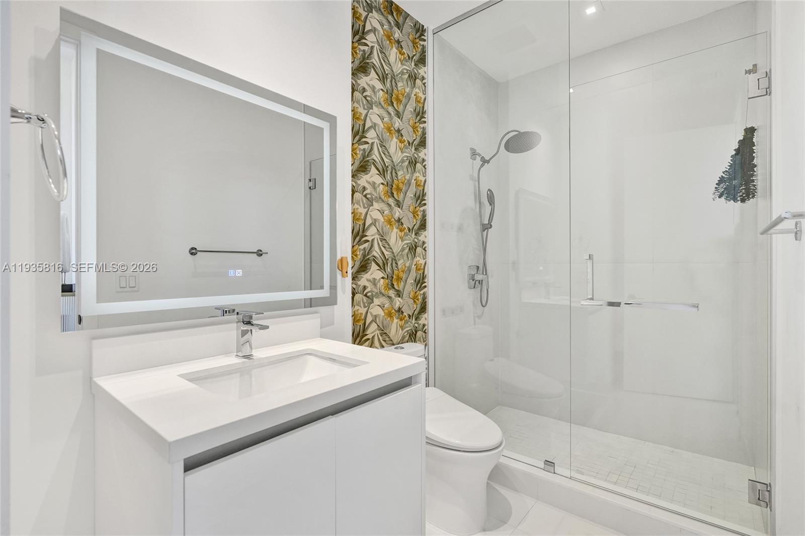 1030 15th Street, Unit PH5 Miami Beach, FL 33139 - Photo 9 of 38 a bathroom with a sink toilet and shower