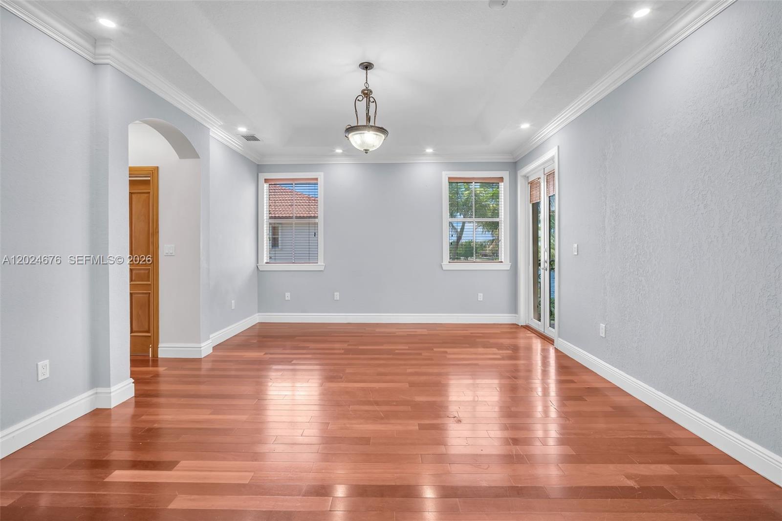 2155 Southwest 156th Court Miami, FL 33185 - Photo 38 of 57 a view of an empty room with wooden floor and a window