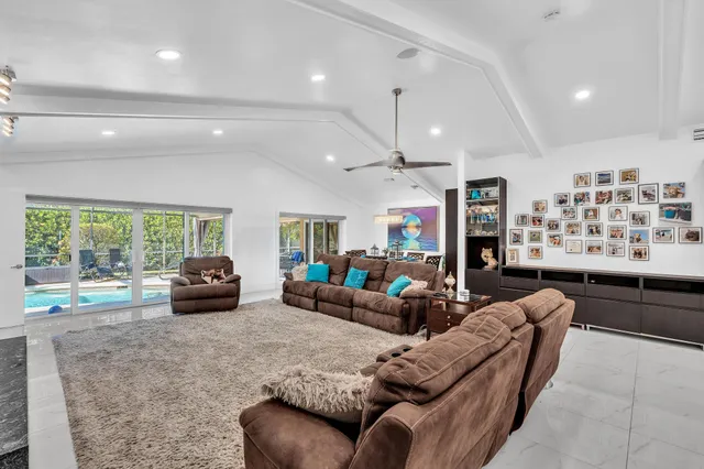 a kitchen with granite countertop white cabinets and stainless steel appliances