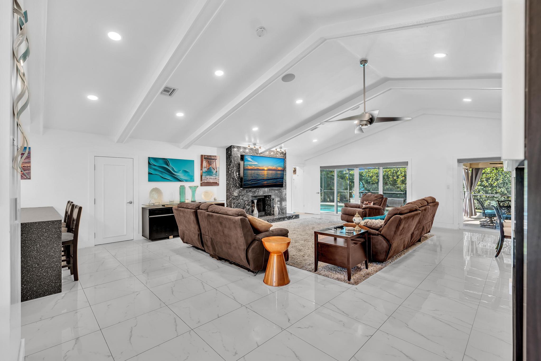 20104 Back 9 Drive Boca Raton, FL 33498 - Photo 15 of 78 a living room with furniture kitchen view and a large window